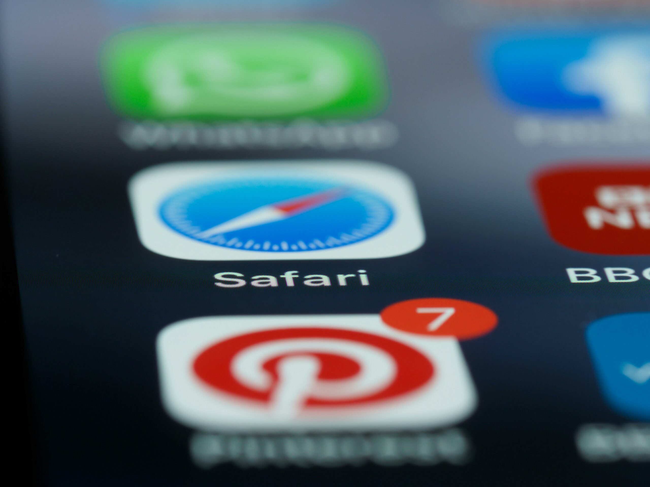 A close up of a screen that shows the Pinterest logo