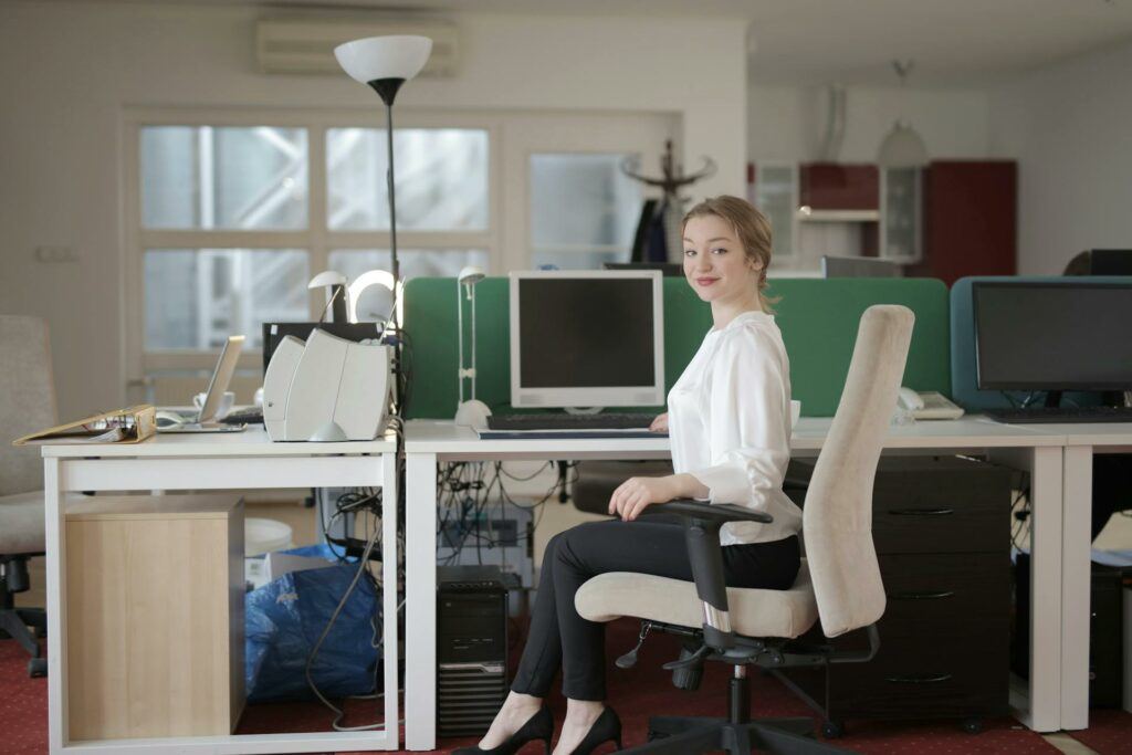 A woman in her home office looking accomplished.